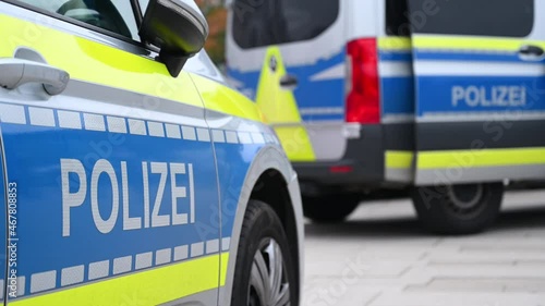 German police cars on the street. Side view of a police car with the lettering 