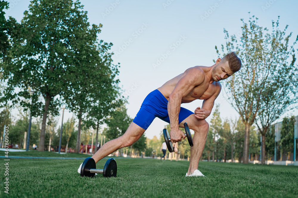 sporty man in park exercise crossfit workout