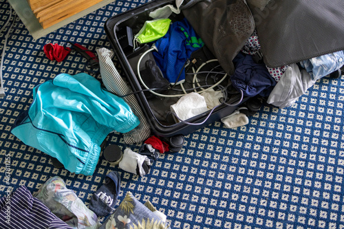 Messy laundry from suitcase