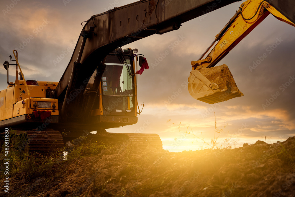 Backhoe At Construction Site Digging Soil With Bucket Of Backhoe