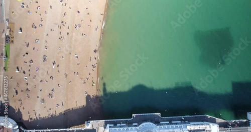 Aerial view of Brighton beach full of people in England