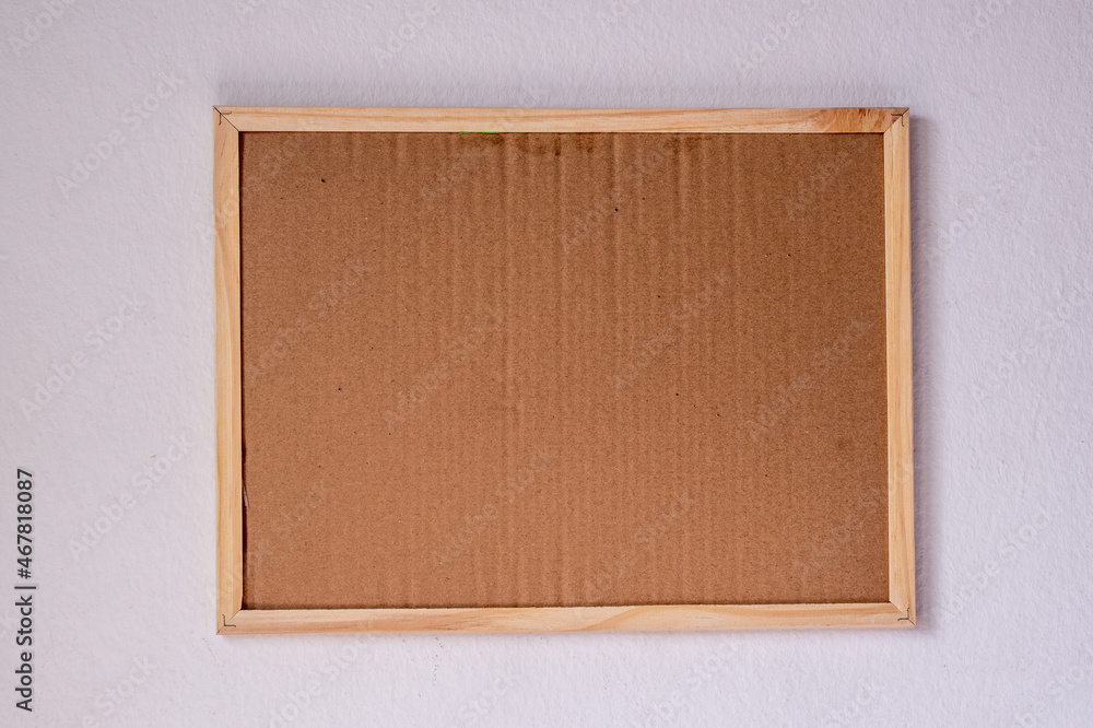 Fototapeta premium brown wooden board whiteboard frame on white wall background