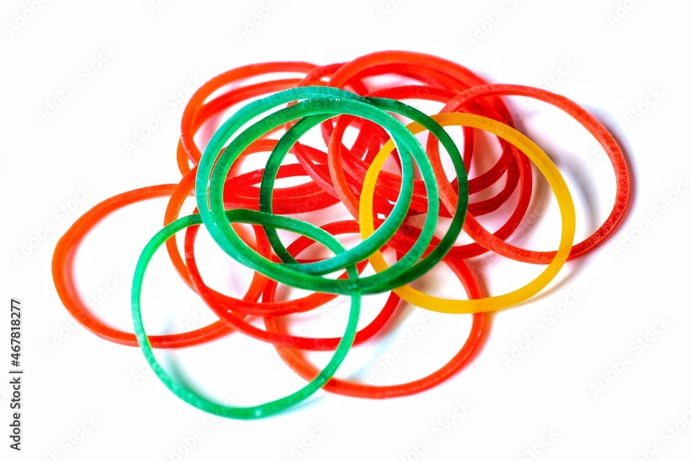 bright red green yellow rubber band on white background bright red green yellow rubber band on white background
