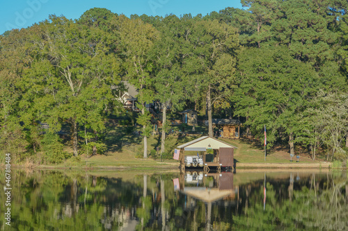 Mirror Image on Lake Cherokee of boat houses and trees. In East Henderson, Rusk County, Texas