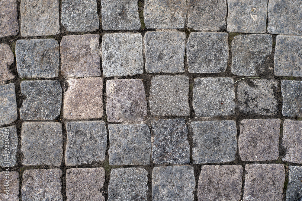 Texture of stone, granite, marble, rustic cobblestones, used for construction or for the elaboration of decorative floors, being very durable over time Texture of stone, granite, marble, rustic cobblestones, used for construction or for the elaboration of decorative floors, being very durable over time