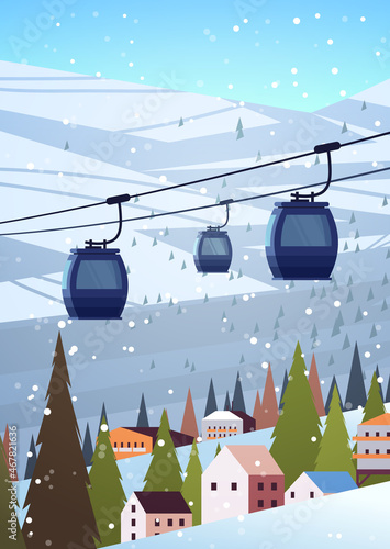 cableway in snowy mountains residential houses area ski resort christmas new year holidays celebration winter vacation