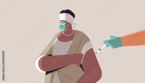 doctor hand vaccinating african american female patient in medical mask fight against coronavirus vaccine development