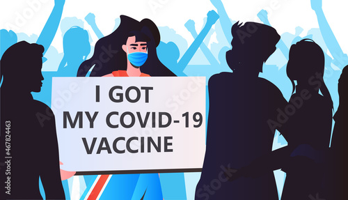 vaccinated woman protester after vaccine injection holding i got my covid-19 vaccine successful vaccination concept