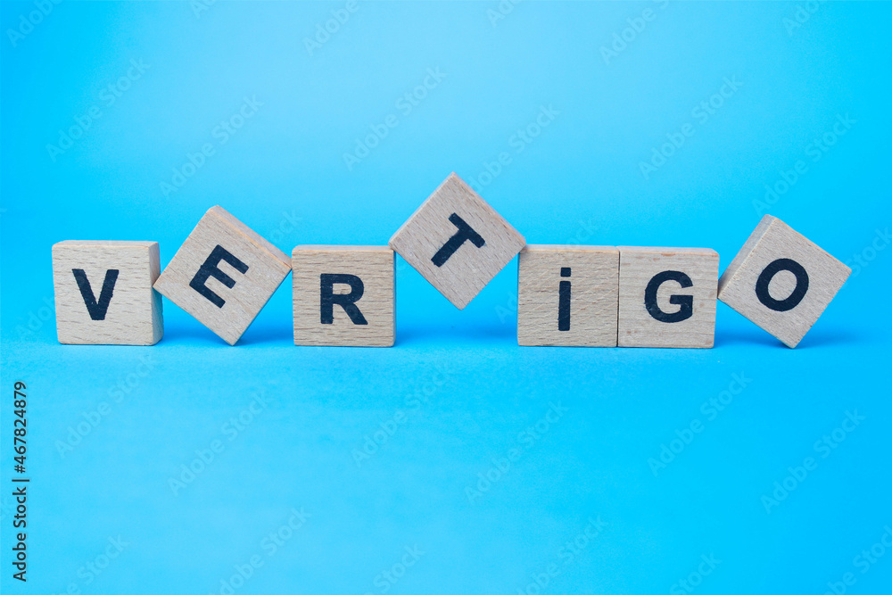 vertigo word written in wooden letters vertigo word written in wooden letters