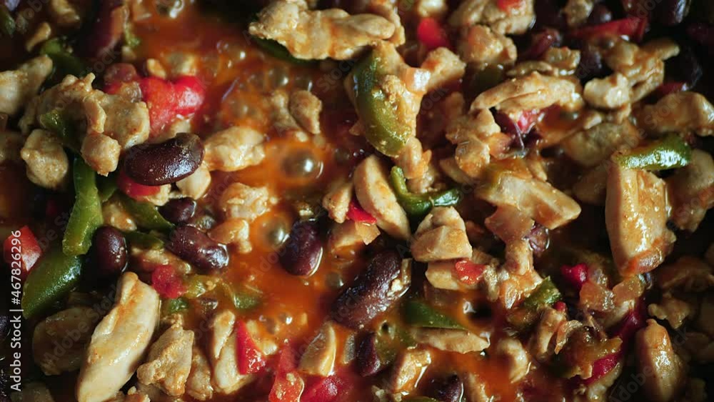 Fajita filling mix sizzling on the stove top - straight down close up view of homemade, organic goodness Fajita filling mix sizzling on the stove top - straight down close up view of homemade, organic goodness