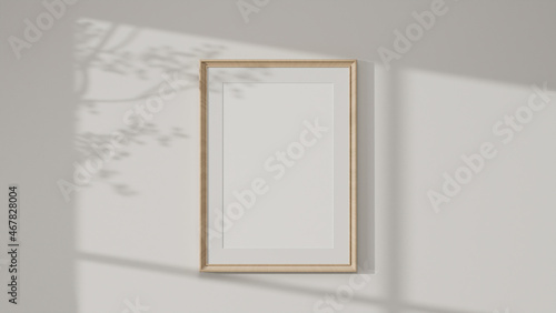 Minimal wooden picture poster frame mockup on white wallpaper © bongkarn