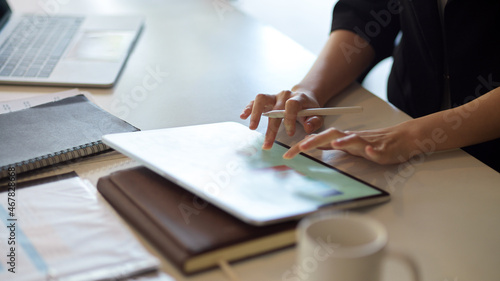 Female entrepreneur working on tablet