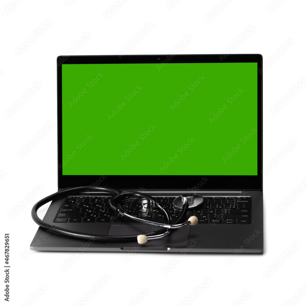 Medical stethoscope on laptop keyboard, chromakey screen. Artificial ...