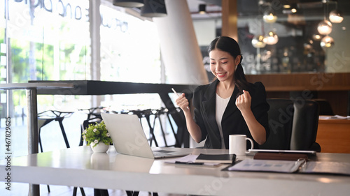Free Download Excited businesswoman reading letter or notice with good news and celebrating her achievement. - GFXLoad
