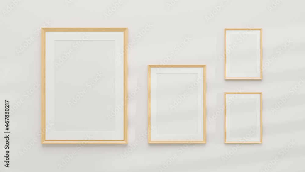 Mockup of multiple minimal wooden picture poster frames on a white wall Mockup of multiple minimal wooden picture poster frames on a white wall