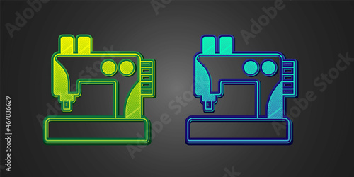 Green and blue Sewing machine icon isolated on black background. Vector