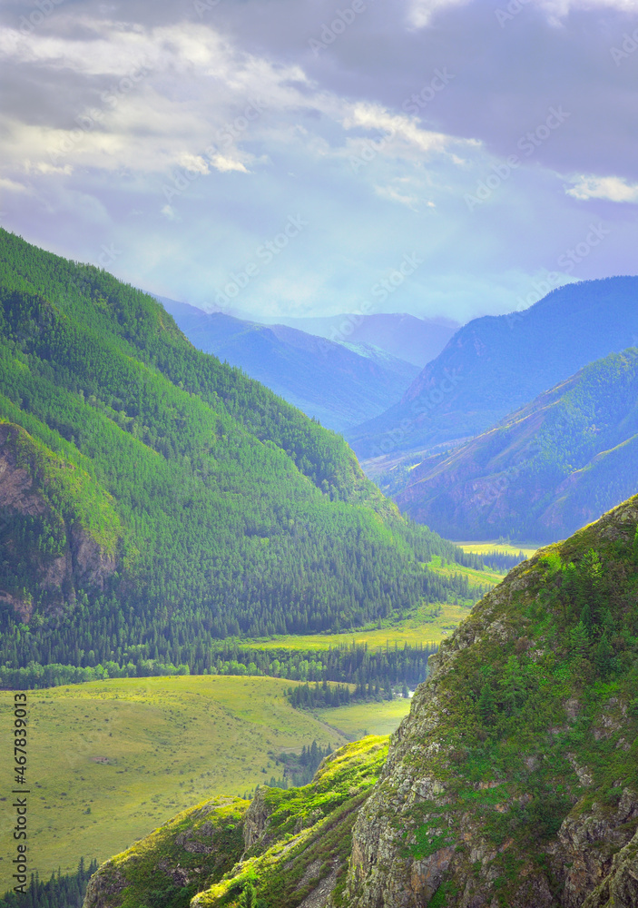 Altai mountains under a cloudy blue sky