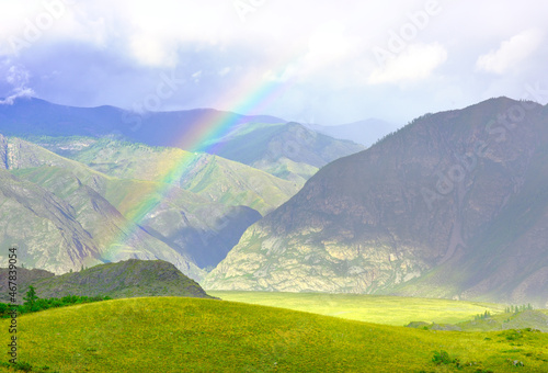 Rainbow in a mountain valley