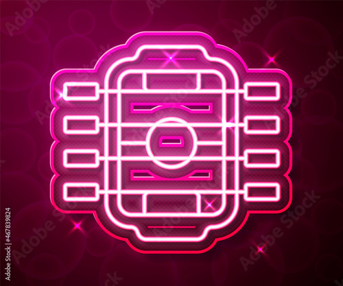 Glowing neon line Table football game hobby or leisure icon isolated on red background. Sport team football players. Vector