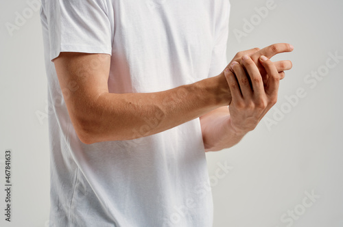 man holding hand injury health problem