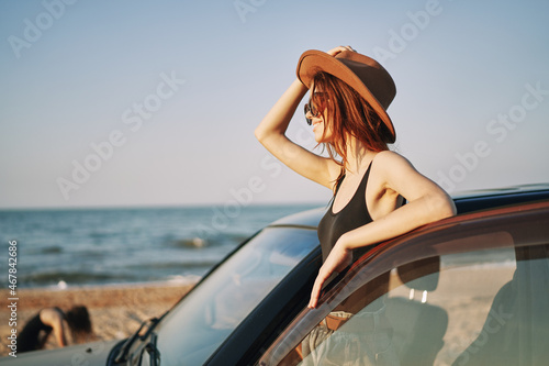 woman on the beach near car travel adventure summer © VICHIZH