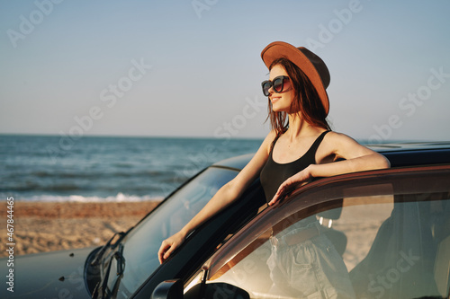 woman on the beach near car travel adventure summer © VICHIZH
