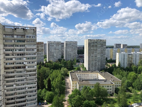 Canvas Print a view down on the forest and the city. summer, moscow region