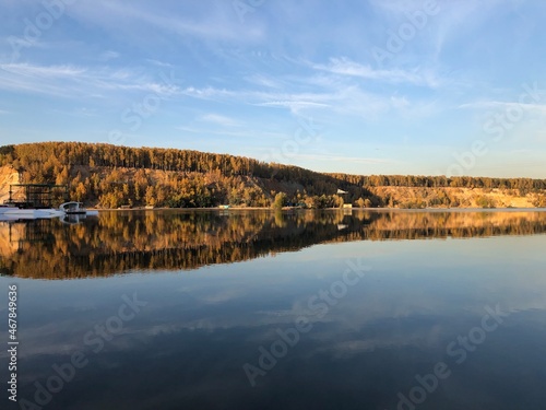 autumn forest on Dzerzhinsky lake  sunny evening