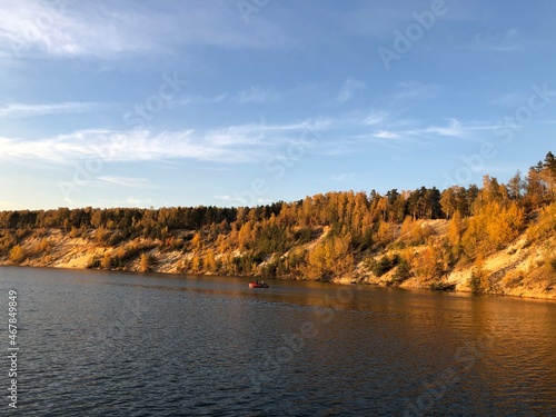 autumn forest on Dzerzhinsky lake, sunny evening