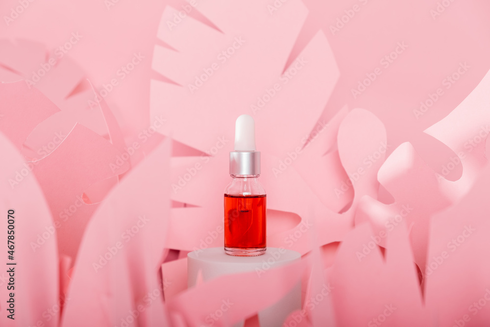 Dropper glass bottles with pipette standing on a white podium. Transparent hyaluronic natural beauty mineral product and eco serum skin care concept. Dropper glass bottles with pipette standing on a white podium. Transparent hyaluronic natural beauty mineral product and eco serum skin care concept.