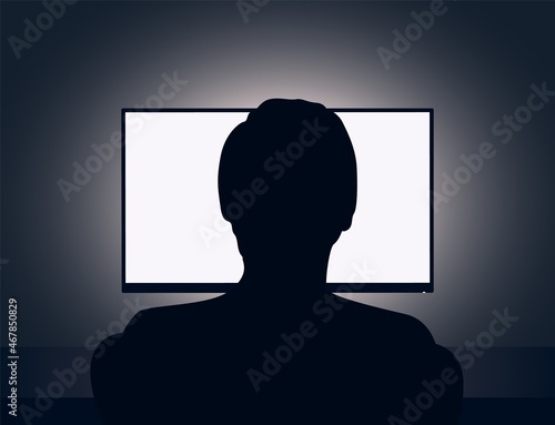 Vector illustration of man sits in front of a blank monitor in dark room