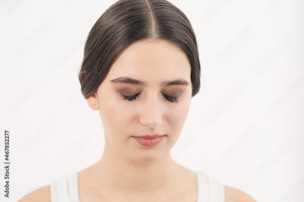 Young girl crying in the frame. Face close up. Spoiled makeup through tears. Young girl crying in the frame. Face close up. Spoiled makeup through tears.