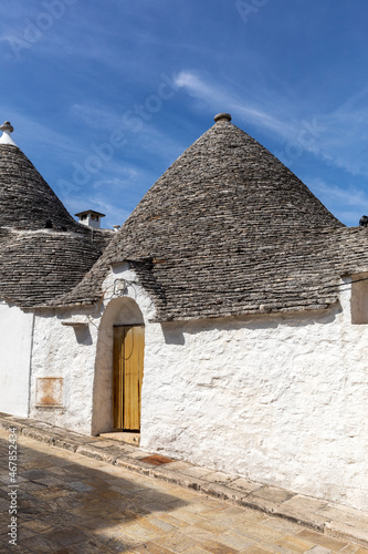  Trulli village in Alberobello, Italy. The style of construction is specific to the Murge area of the Italian region of Apulia (in Italian Puglia). Made of limestone and keystone.