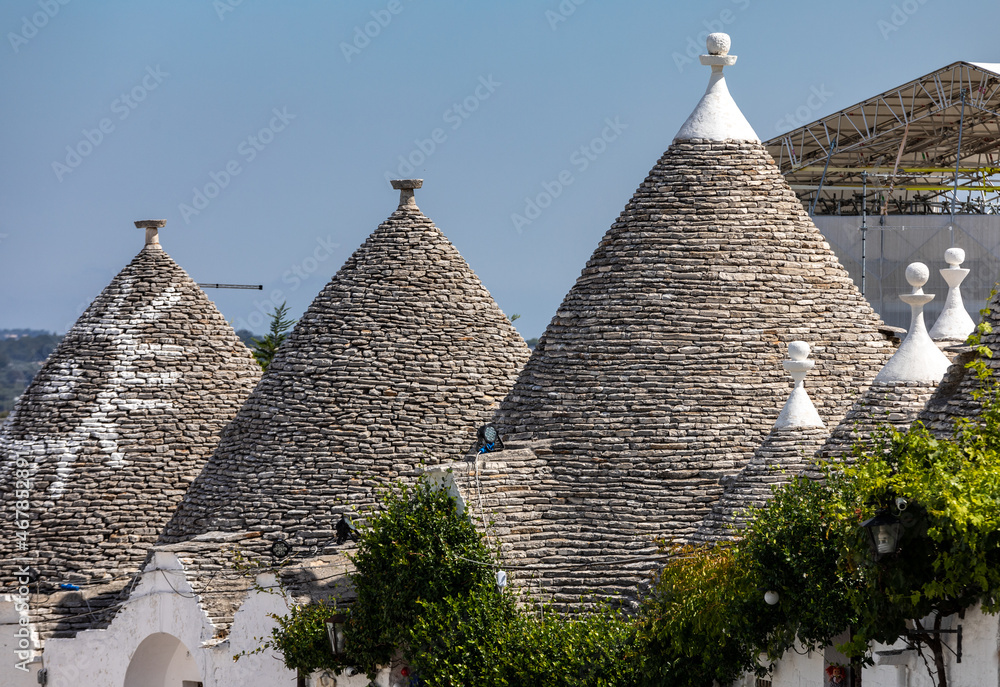 Stone roofs of Trulli Houses in Alberobello; Italy. The style of construction is specific to the Murge area of the Italian region of Apulia (in Italian Puglia). Made of limestone and keystone.