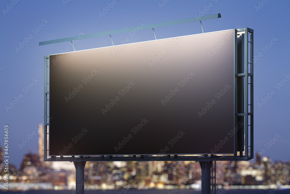 Blank black billboard on cityscape background at evening, perspective view. Mock up, advertising concept Blank black billboard on cityscape background at evening, perspective view. Mock up, advertising concept