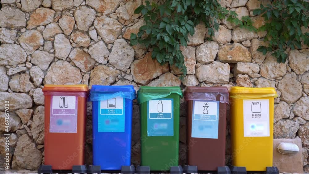Plastic paper glass metal organic waste sorting. Different Colored Recycle Waste Bins outdoors. Separate waste collection Plastic paper glass metal organic waste sorting. Different Colored Recycle Waste Bins outdoors. Separate waste collection