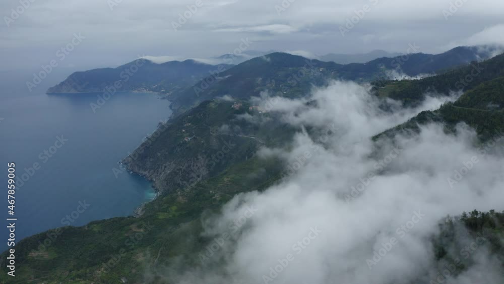 Aerial Scenic Shot Of Clouds Over Green Mountains By Ocean - Cinque Terre, Italy Aerial Scenic Shot Of Clouds Over Green Mountains By Ocean - Cinque Terre, Italy