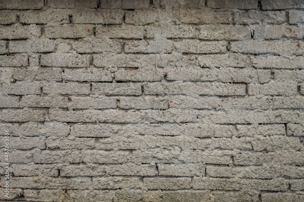 Brick wall with coarse cement rendering finish Brick wall with coarse cement rendering finish