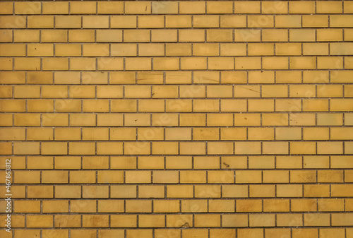 Exterior wall lined with yellow glazed ceramic tiles