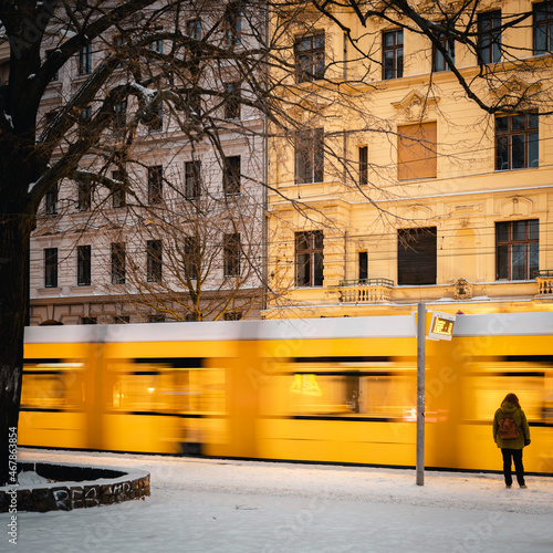 Waiting person in front of a tram in winter  (ID: 467863854)
