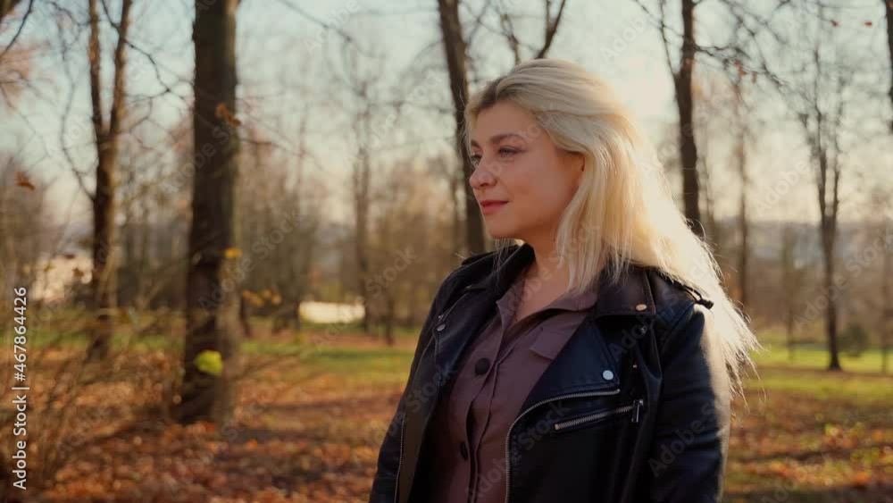 360 Portrait female person looking at camera in autumn park. Adult 30s woman caucasian ethnicity smile laugh and breath outdoors in sunshine light 360 Portrait female person looking at camera in autumn park. Adult 30s woman caucasian ethnicity smile laugh and breath outdoors in sunshine light