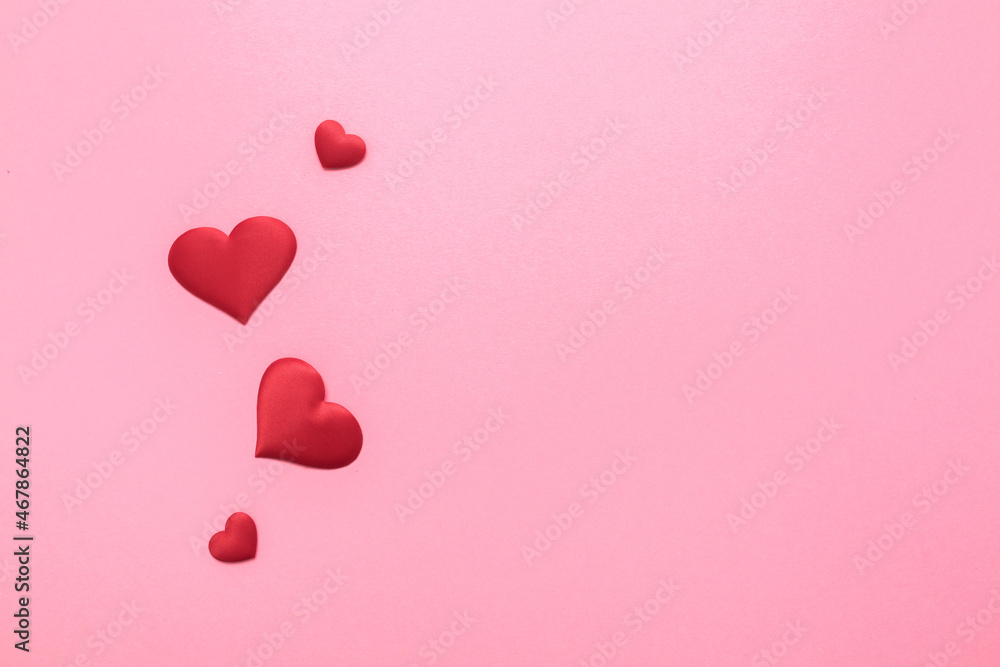 Valentine's Day. Love background. Gifts in the form of hearts on a pink background with the inscription love. Copy space for text. The concept of romance and love.
