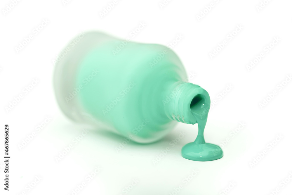 Set of multi-colored nail polish on a white background. Long banner. Manicure and pedicure selection of any colors. Liquid flows from the vial. Set of multi-colored nail polish on a white background. Long banner. Manicure and pedicure selection of any colors. Liquid flows from the vial.