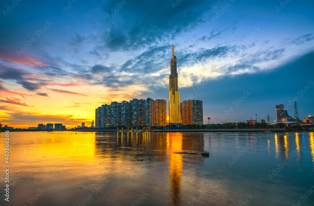 Riverside urban area at sunset sky after a period of social distancing because of the pandemic has revived in Ho Chi Minh City, Vietnam