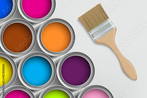 Paint brush and buckets with multi colored paint.