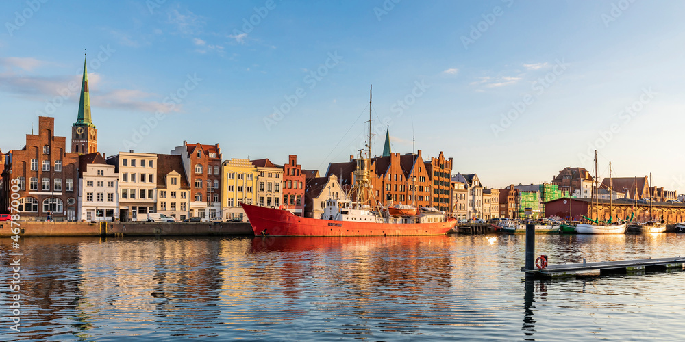 Germany, Schleswig-Holstein, Lubeck, Panoramic view of river Trave with moored ship and historic townhouses in background Germany, Schleswig-Holstein, Lubeck, Panoramic view of river Trave with moored ship and historic townhouses in background