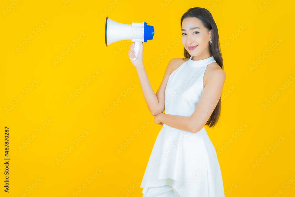 Portrait beautiful young asian woman smile with megaphone Portrait beautiful young asian woman smile with megaphone