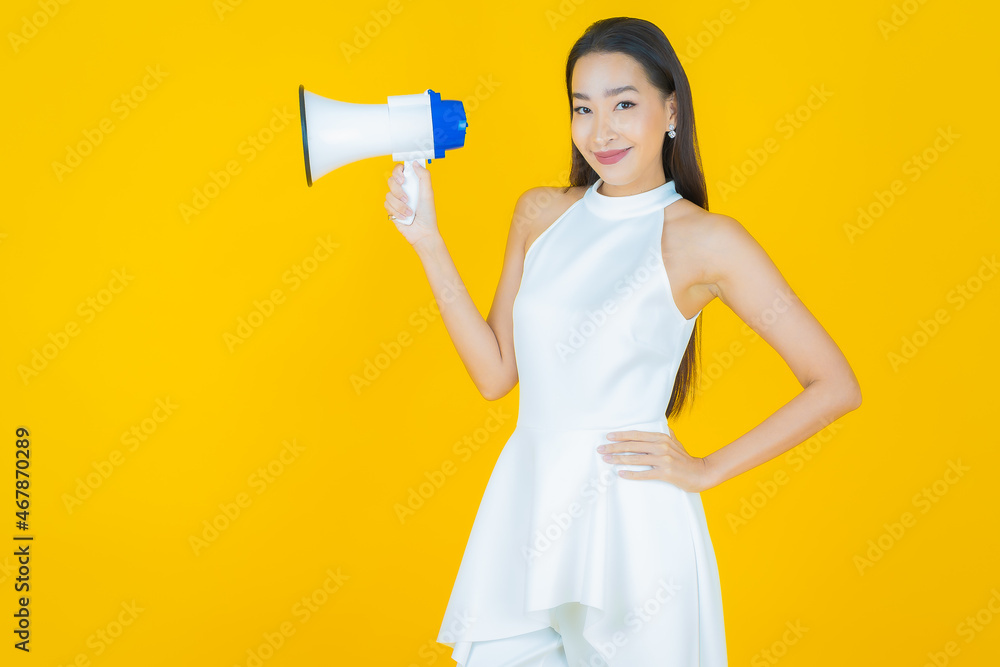 Portrait beautiful young asian woman smile with megaphone Portrait beautiful young asian woman smile with megaphone