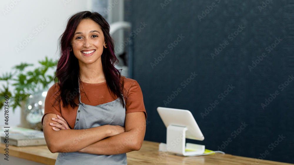 Small business owner at a cash register - obrazy, fototapety, plakaty 