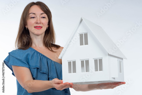 Girl with a house model in ...